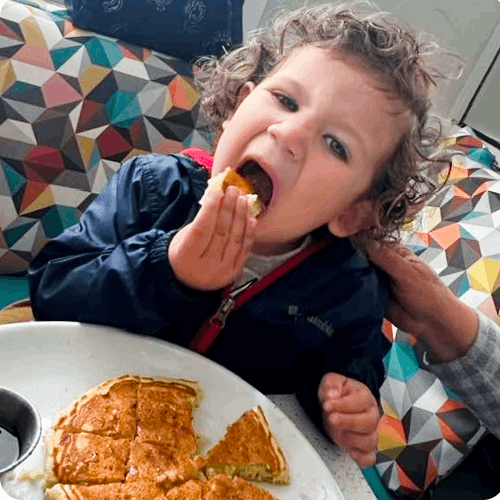 Child eating pancakes at 31st Grill Salinas